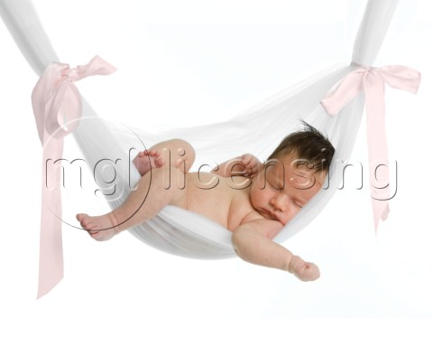 Baby in pink ribbon hammock