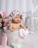 Baby in flowery bucket