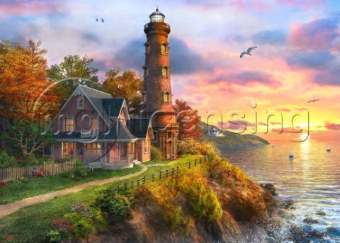 The lighthouse overlooking an ocean at sunset