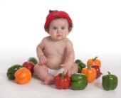 Baby in knitted pepper hat